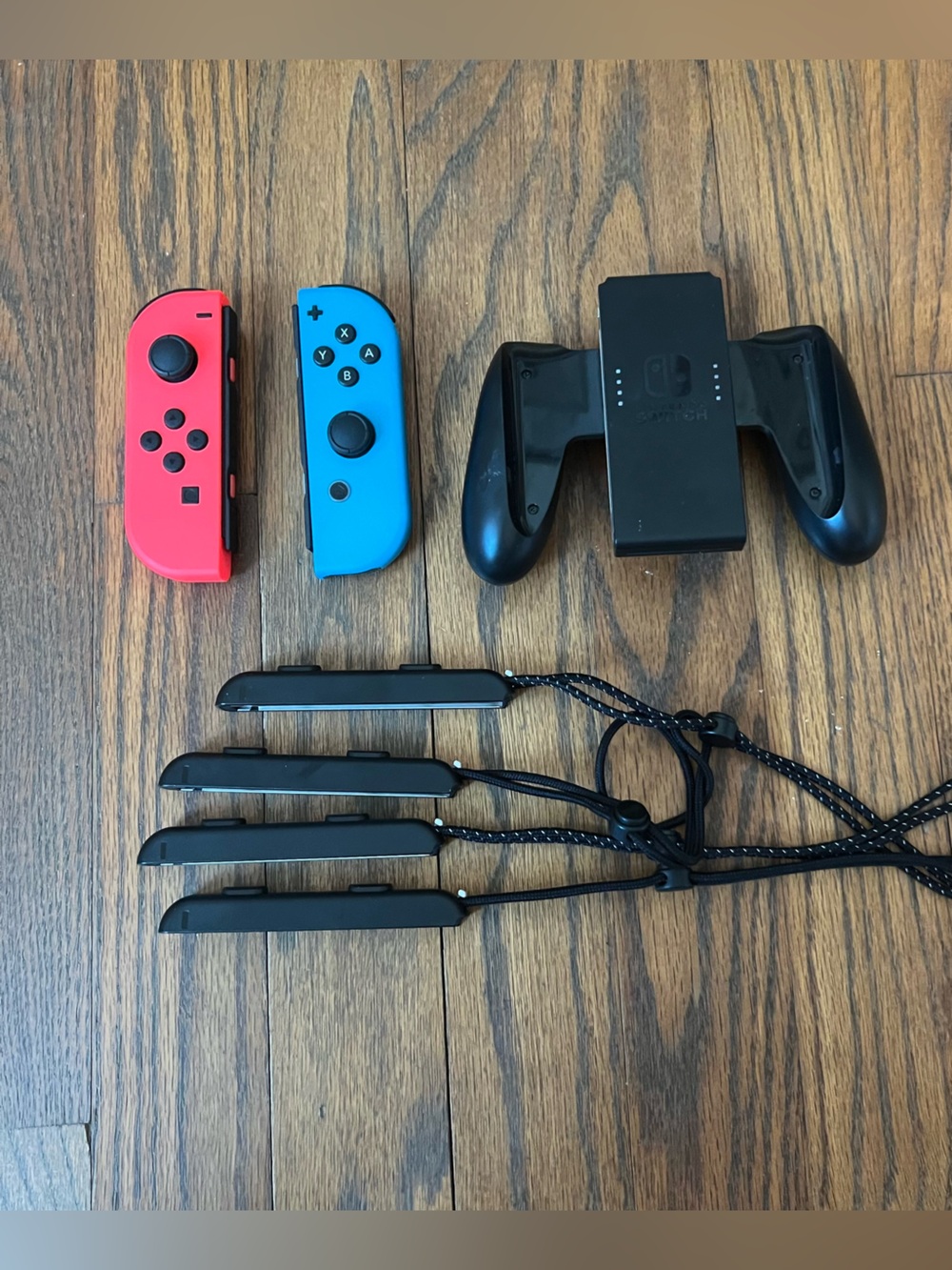 Nintendo Switch accessories lot Joy-Con Controllers in Neon Red and Neon Blue